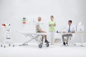 Station MESI mTABLET installée dans une salle d’examen avec patient et personnel soignant